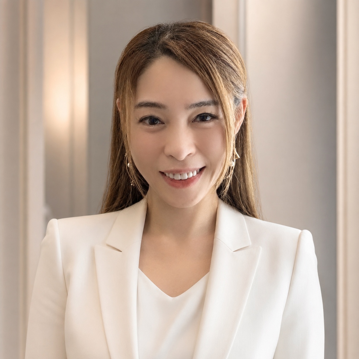 Nicole Hew in a white blazer
